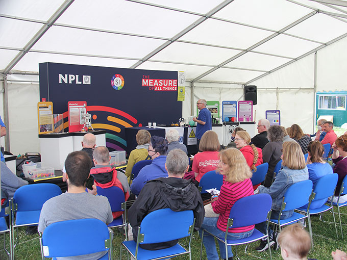 /getattachment/622c9837-6579-403a-a4c3-8bac57c4d22b/IMG_9521-680x510.jpg?lang=en-GB Andrew Hanson giving a workshop on importance of metrology to audience at NPL open day